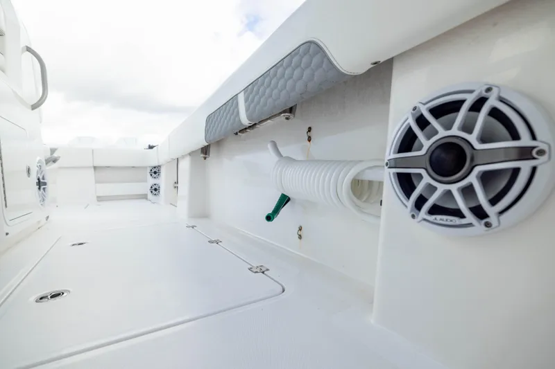 Slide: The Image of 2024 Invincible 35 Catamaran deck with speakers and storage compartments. - 28