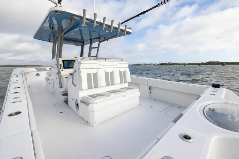 Slide: The Image of 2024 Invincible 35 Catamaran on water, featuring spacious deck and modern seating. - 29