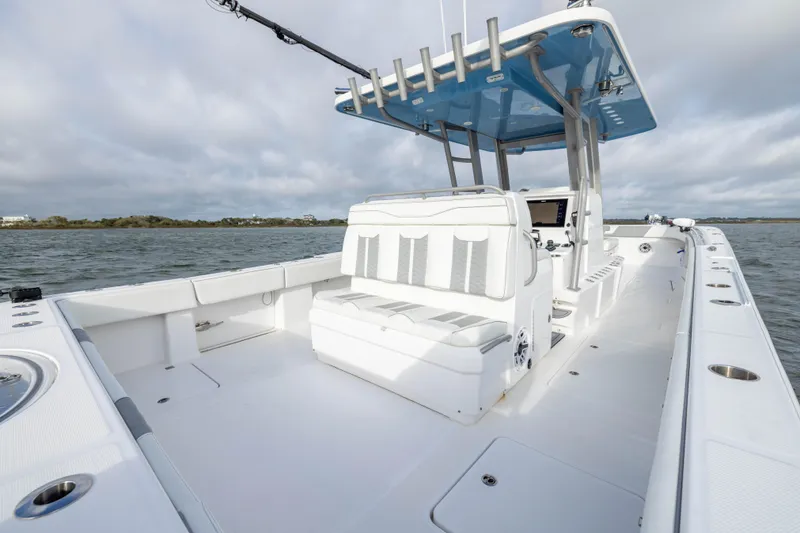 Slide: The Image of 2024 Invincible 35 Catamaran with sleek seating and modern helm on open water. - 30