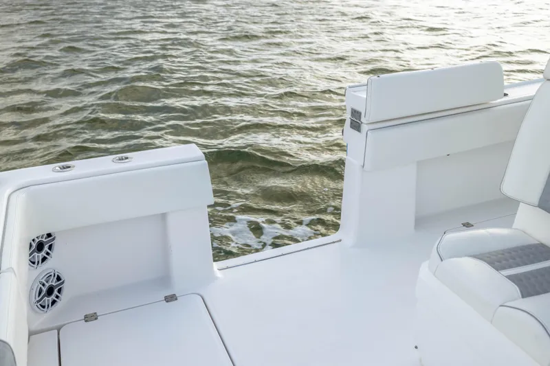 Slide: The Image of 2024 Invincible 35 Catamaran boat deck with seating, overlooking water. - 33