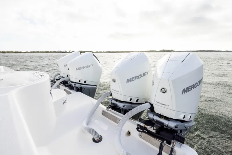 Slide: The Image of 2024 Invincible 35 Catamaran with triple Mercury Verado engines on open water. - 34