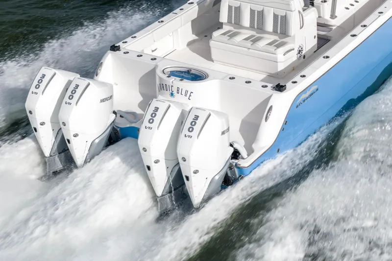Slide: The Image of 2024 Invincible 35 Catamaran with quad Mercury 300 V8 engines on water. - 35