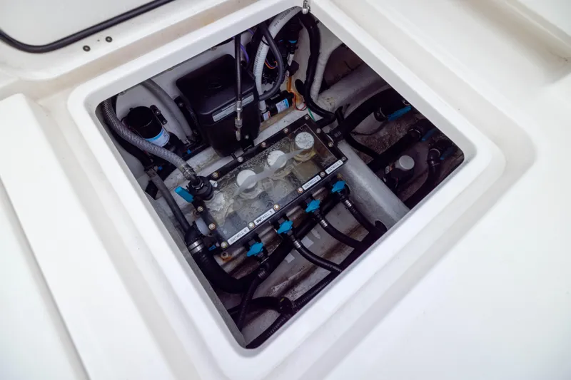 Slide: The Image of Engine compartment of 2024 Invincible 35 Catamaran, showcasing intricate mechanical components. - 36