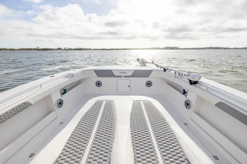 Slide: The Image of 2024 Invincible 35 Catamaran on water, showcasing spacious deck and modern design. - 9