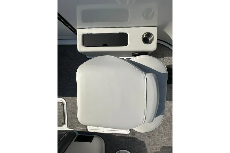 Slide: The Image of Captain's seat on 2026 Hurricane FunDeck 1960 REF OB boat, featuring cup holder and storage. - 10