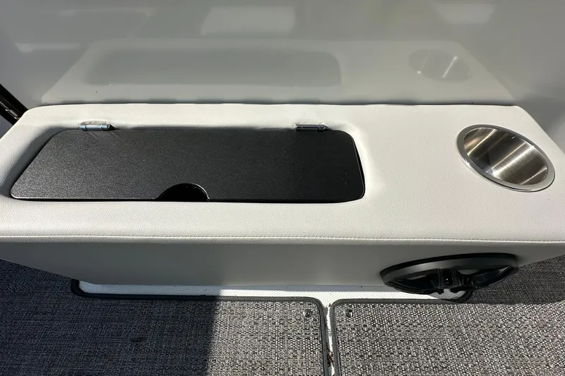 Slide: The Image of 2026 Hurricane FunDeck 1960 REF OB boat interior with storage compartment and cup holder. - 11