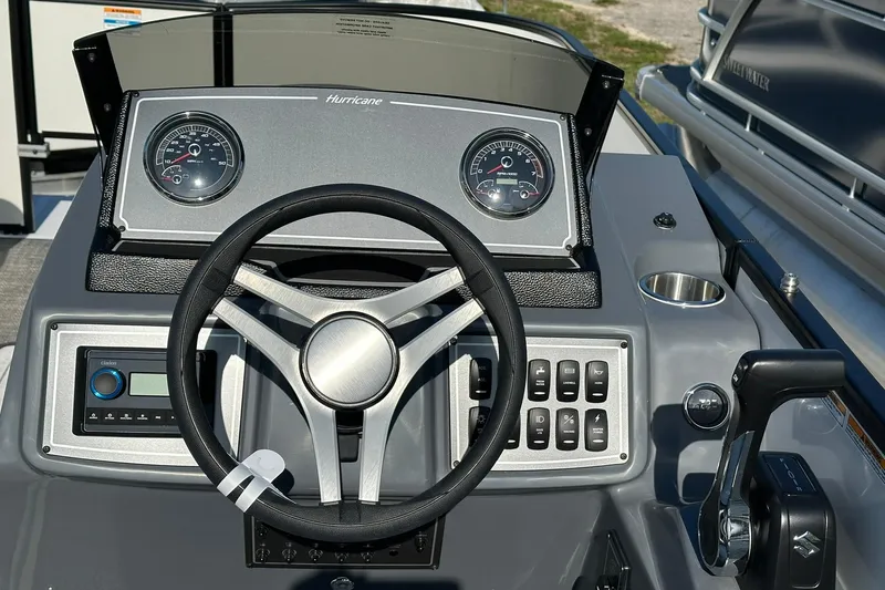 Slide: The Image of Steering console of 2026 Hurricane FunDeck 1960 REF OB boat with gauges and controls. - 14