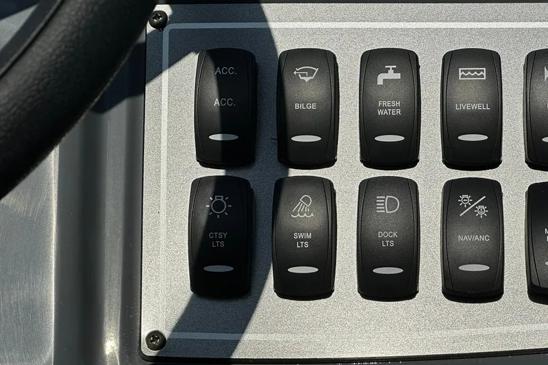 Slide: The Image of Dashboard switches on a 2026 Hurricane FunDeck 1960 REF OB boat. - 17
