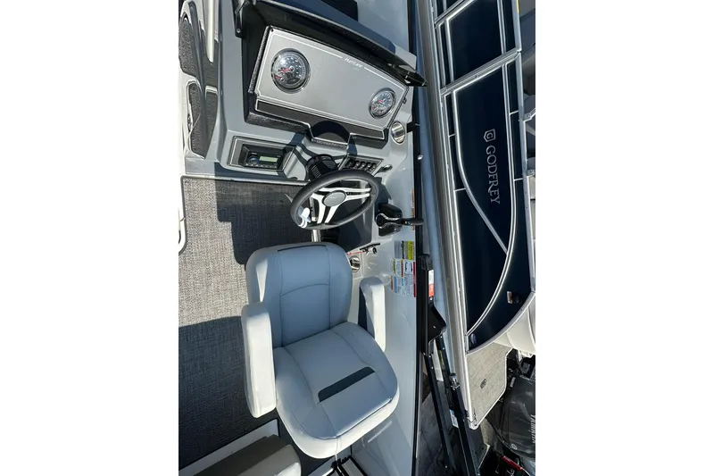 Slide: The Image of 2026 Hurricane FunDeck 1960 REF OB boat interior with steering wheel and seating. - 22