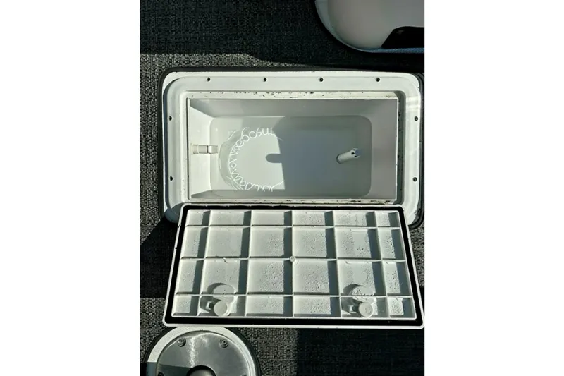 Slide: The Image of Open storage compartment on 2026 Hurricane FunDeck 1960 REF OB boat. - 25
