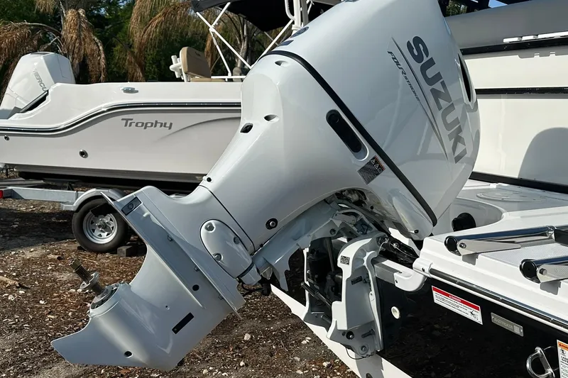 Slide: The Image of Outboard motor on a 2026 Hurricane FunDeck 1960 REF OB boat, parked on a trailer. - 26
