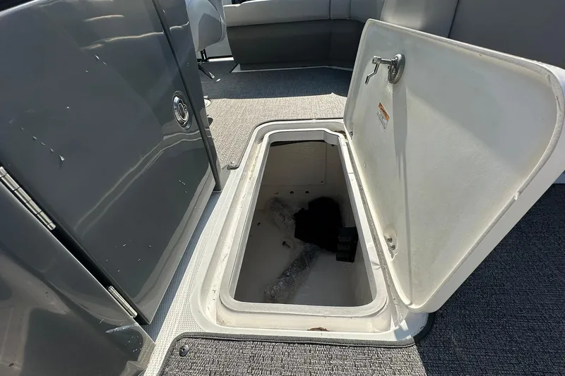 Slide: The Image of Open storage compartment on 2026 Hurricane FunDeck 1960 REF OB boat. - 28