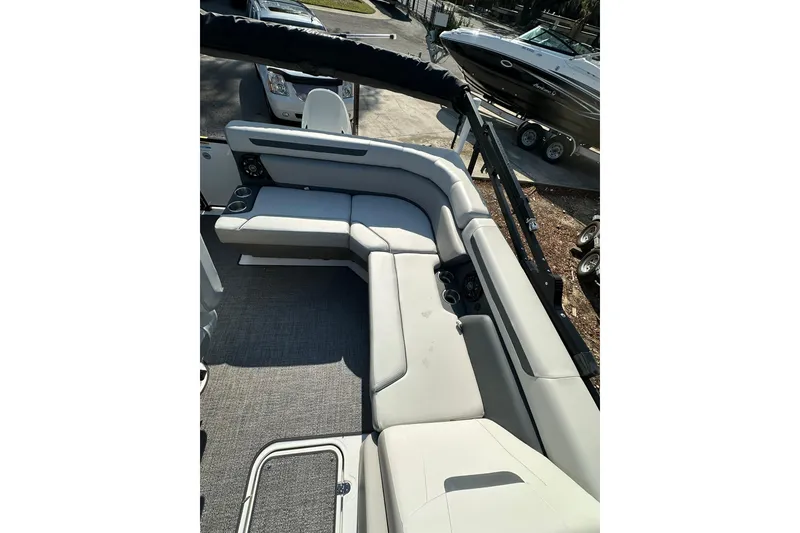 Slide: The Image of 2026 Hurricane FunDeck 1960 REF OB boat interior with gray seating and carpet. - 31