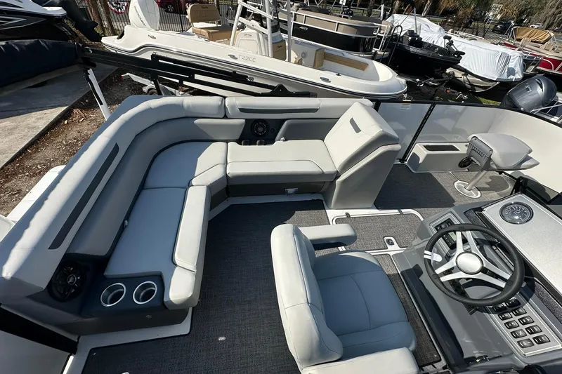 Slide: The Image of 2026 Hurricane FunDeck 1960 REF OB boat interior with seating and steering wheel. - 33