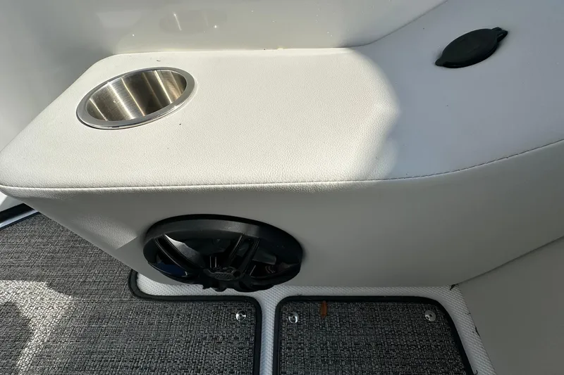 Slide: The Image of Cup holder and speaker on 2026 Hurricane FunDeck 1960 REF OB boat interior. - 7