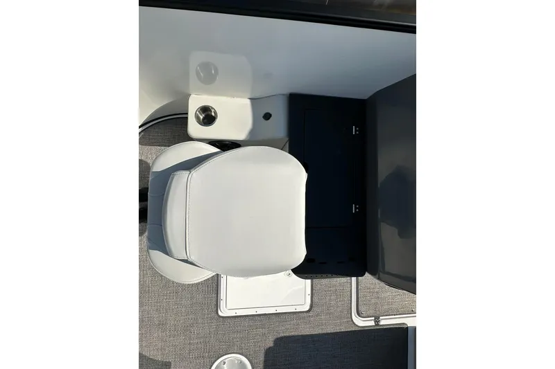Slide: The Image of Captain's seat on 2026 Hurricane FunDeck 1960 REF OB boat, featuring sleek design and cup holder. - 8