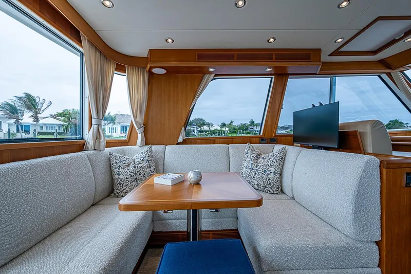 Slide: The Image of Luxurious interior of 2014 Grand Banks 46 Eastbay SX yacht with elegant seating and large windows. - 19