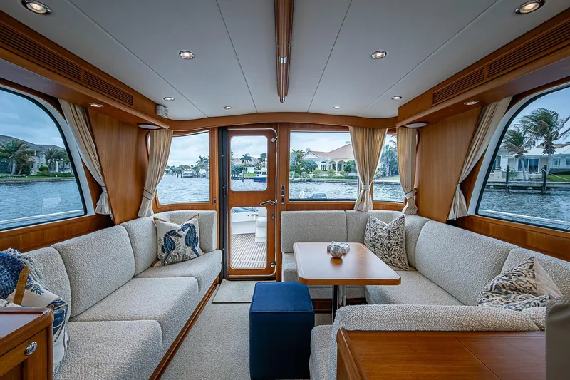 Slide: The Image of Luxurious interior of 2014 Grand Banks 46 Eastbay SX yacht with elegant seating and waterfront view. - 2