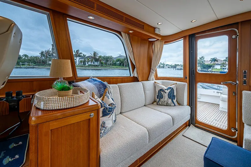 Slide: The Image of Luxurious interior of 2014 Grand Banks 46 Eastbay SX yacht with elegant seating and scenic views. - 20