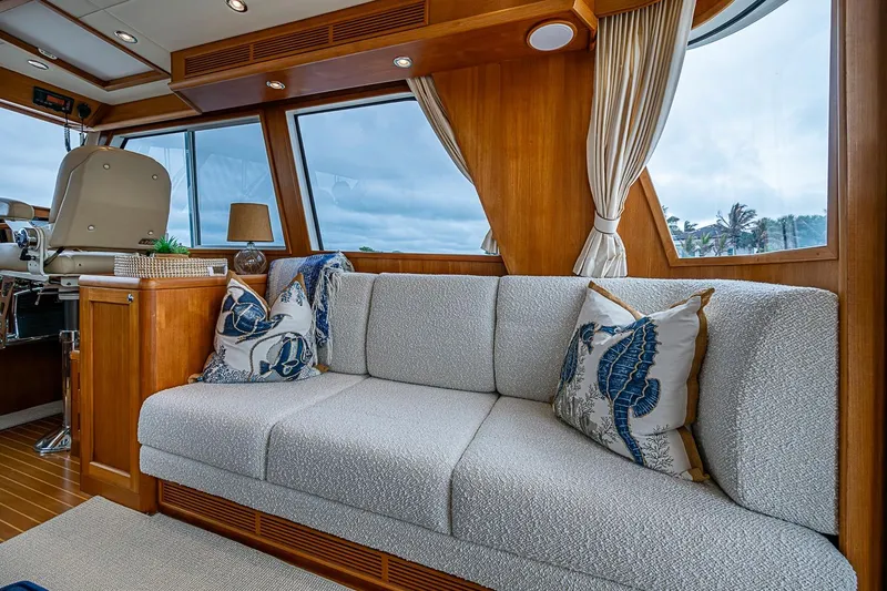 Slide: The Image of Luxurious interior of 2014 Grand Banks 46 Eastbay SX yacht with elegant sofa and nautical decor. - 21