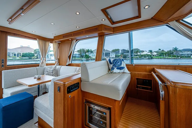 Slide: The Image of Luxurious interior of 2014 Grand Banks 46 Eastbay SX yacht with elegant seating and large windows. - 23