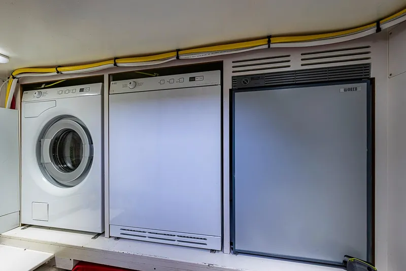 Slide: The Image of Laundry and appliance area on 2014 Grand Banks 46 Eastbay SX yacht. - 32