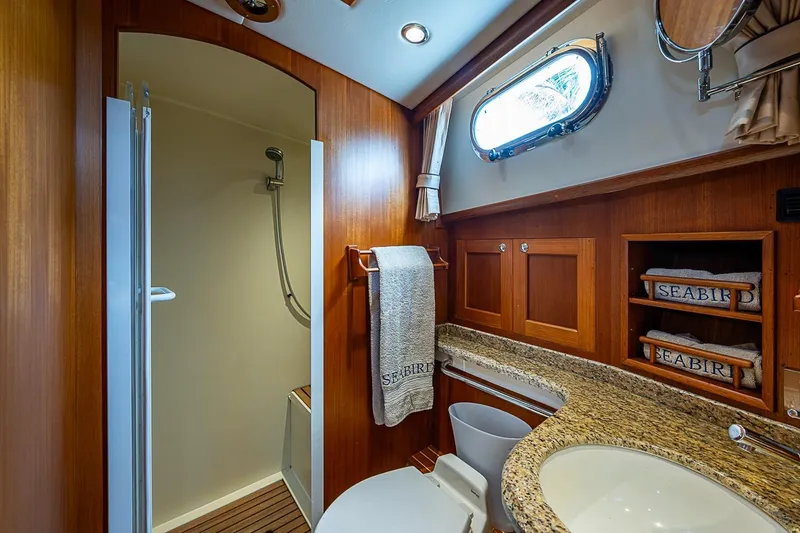 Slide: The Image of Luxurious bathroom on 2014 Grand Banks 46 Eastbay SX yacht with shower and granite countertop. - 38