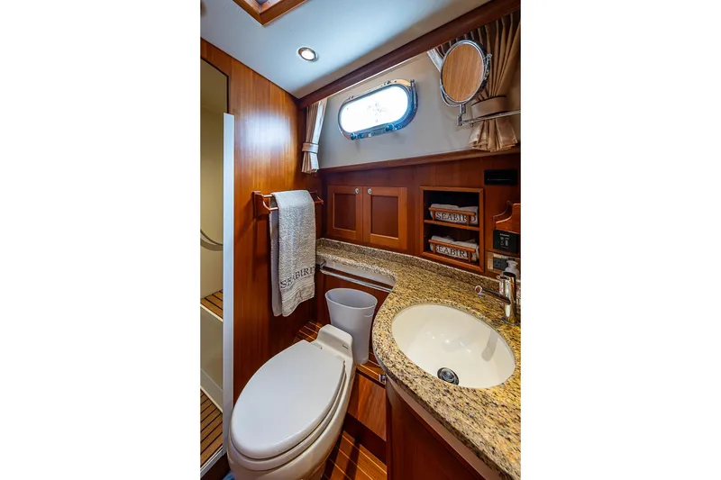 Slide: The Image of Luxurious bathroom in 2014 Grand Banks 46 Eastbay SX yacht with granite countertop. - 39