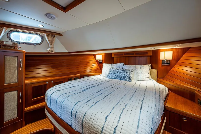 Slide: The Image of Luxurious cabin interior of 2014 Grand Banks 46 Eastbay SX yacht with cozy bedding. - 4