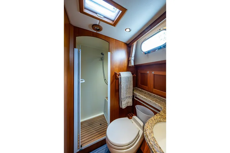 Slide: The Image of Luxurious bathroom in 2014 Grand Banks 46 Eastbay SX yacht with shower and wooden accents. - 40