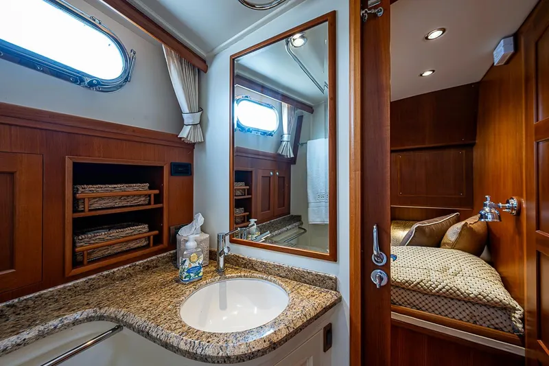 Slide: The Image of Luxurious bathroom interior on 2014 Grand Banks 46 Eastbay SX yacht with granite countertop. - 44
