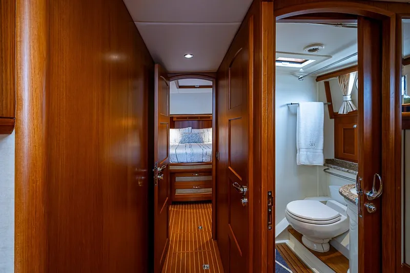Slide: The Image of Luxurious interior of 2014 Grand Banks 46 Eastbay SX yacht with wood finish and bathroom. - 47