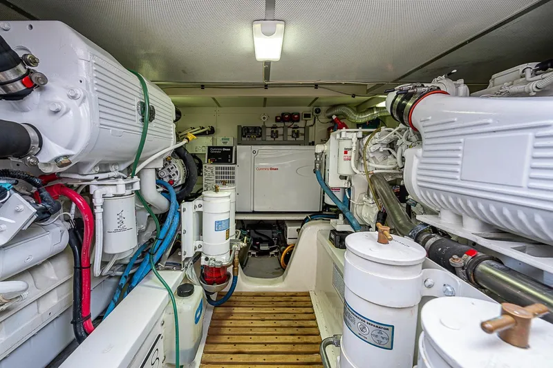 Slide: The Image of Engine room of 2014 Grand Banks 46 Eastbay SX yacht, featuring Cummins generator and machinery. - 49