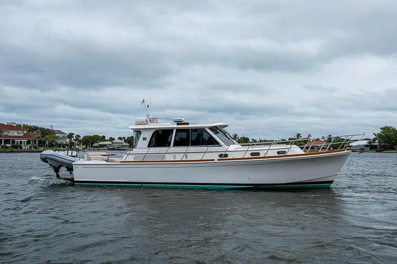 Slide: The Image of 2014 Grand Banks 46 Eastbay SX yacht cruising on a cloudy day. - 5