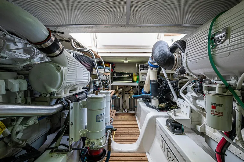 Slide: The Image of Engine room of 2014 Grand Banks 46 Eastbay SX yacht, showcasing mechanical components. - 50