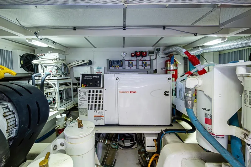 Slide: The Image of Engine room of 2014 Grand Banks 46 Eastbay SX with Cummins Onan generator. - 51