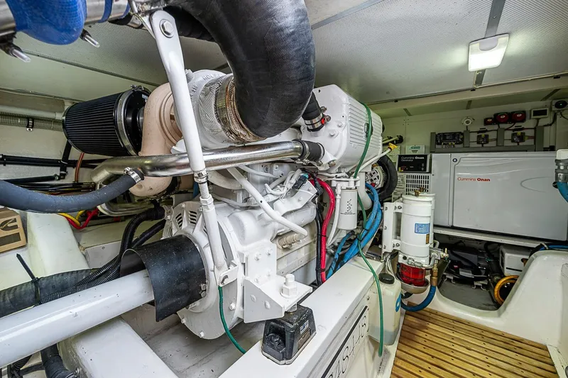 Slide: The Image of Engine room of 2014 Grand Banks 46 Eastbay SX with Cummins Onan generator. - 52