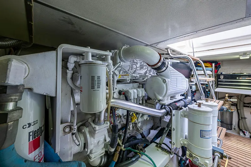 Slide: The Image of Engine room of 2014 Grand Banks 46 Eastbay SX yacht, showcasing mechanical components. - 53