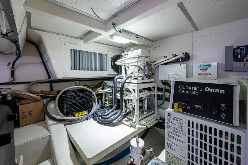 Slide: The Image of Engine room of 2014 Grand Banks 46 Eastbay SX with Cummins Onan generator. - 56