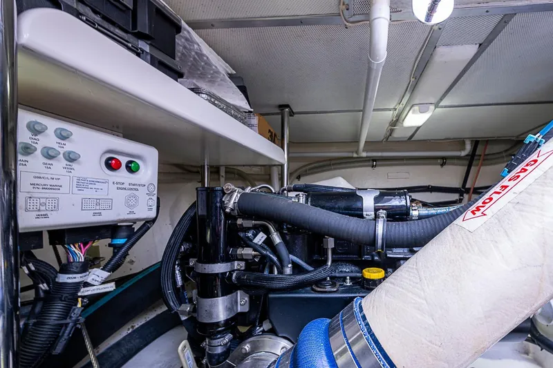 Slide: The Image of Engine room of 2014 Grand Banks 46 Eastbay SX with control panel and machinery. - 57