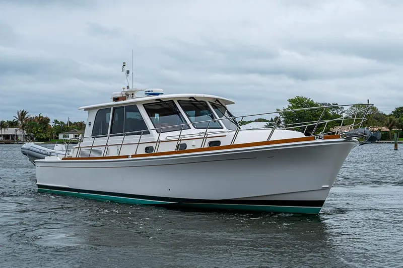 Slide: The Image of 2014 Grand Banks 46 Eastbay SX yacht on water, showcasing sleek design and craftsmanship. - 60