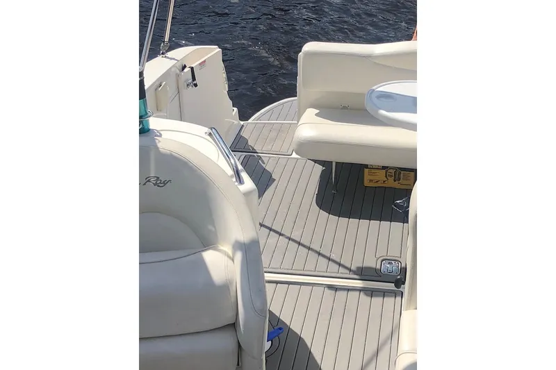 Slide: The Image of 2005 Sea Ray Sundancer 280 boat interior with white seating and deck view. - 6