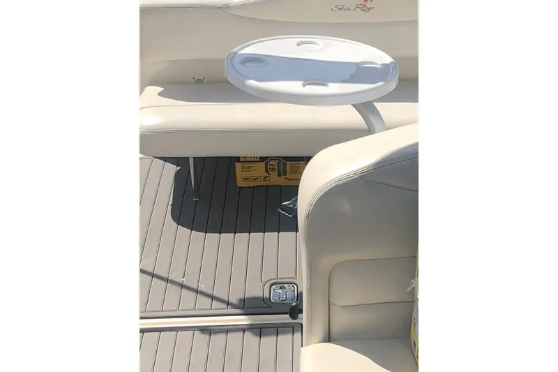 Slide: The Image of 2005 Sea Ray Sundancer 280 interior with seating and table on deck. - 7