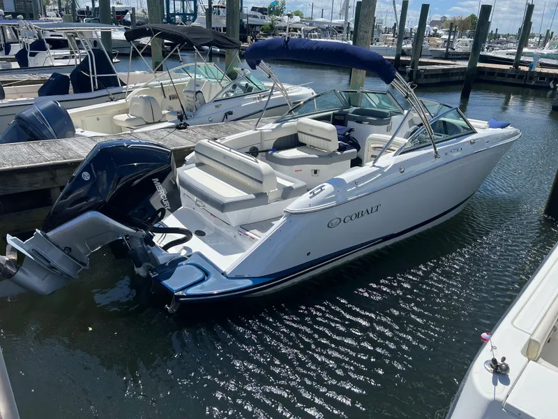 The Image of 2021 Cobalt SC23 OB boat docked at marina. - 1