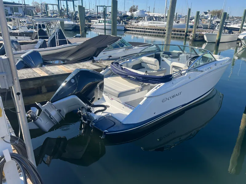 Slide: The Image of 2021 Cobalt SC23 OB boat docked at marina. - 5