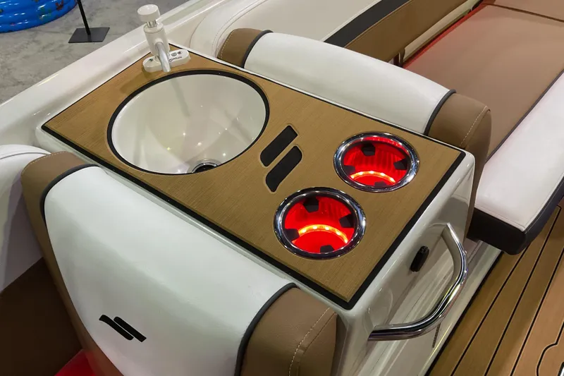 Slide: The Image of 2026 Starcraft SVX 211 OB boat interior with sink and illuminated cup holders. - 11