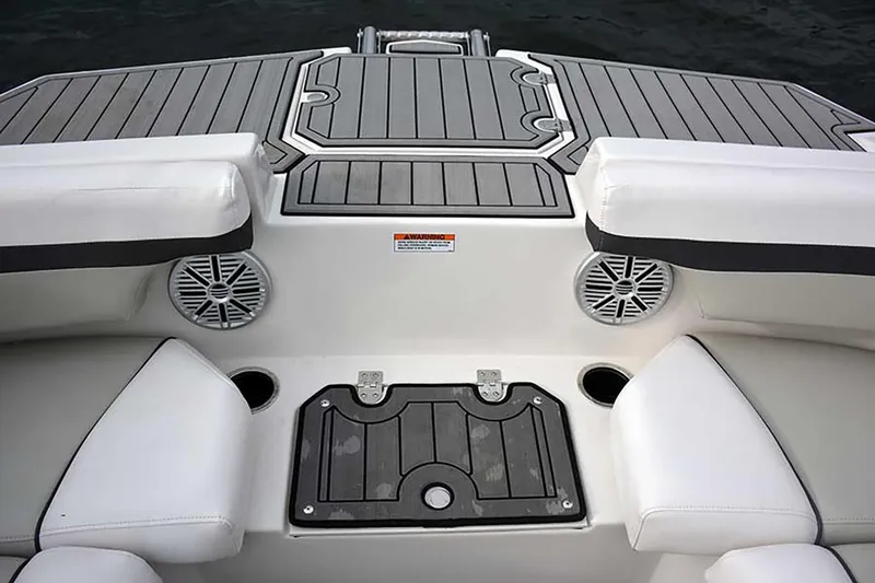 Slide: The Image of Manufacturer Provided Image: 2026 Starcraft SVX 211 OB boat interior with cushioned seating and integrated speakers. - 21