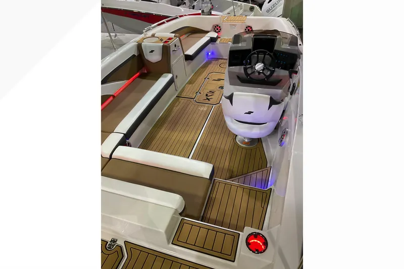 Slide: The Image of 2026 Starcraft SVX 211 OB boat interior with modern seating and sleek dashboard design. - 3