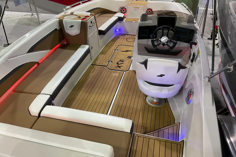 Slide: The Image of 2026 Starcraft SVX 211 OB boat interior with modern seating and sleek dashboard design. - 4