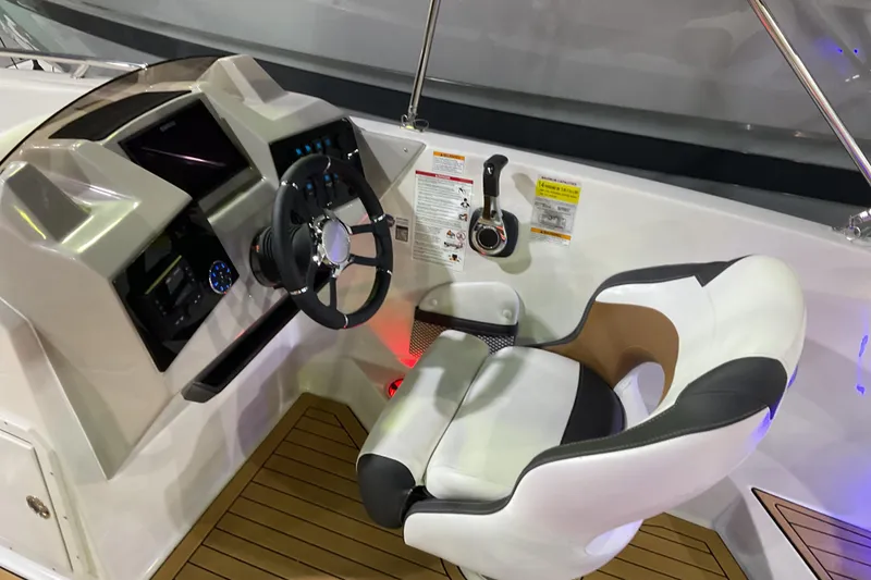 Slide: The Image of Cockpit of 2026 Starcraft SVX 211 OB boat with modern steering and controls. - 6